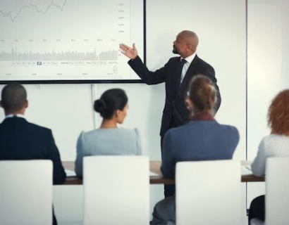 African business leaders in a strategy meeting reviewing market research insights.