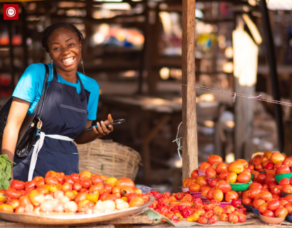 Field interviewer recruiting a market trader for a consumer panel in Africa
